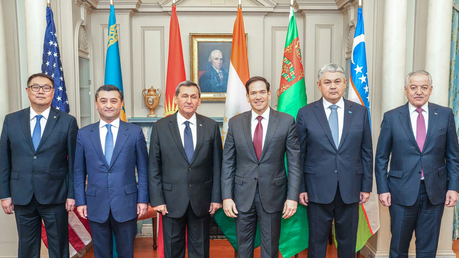 Officials seated at an international development policy meeting